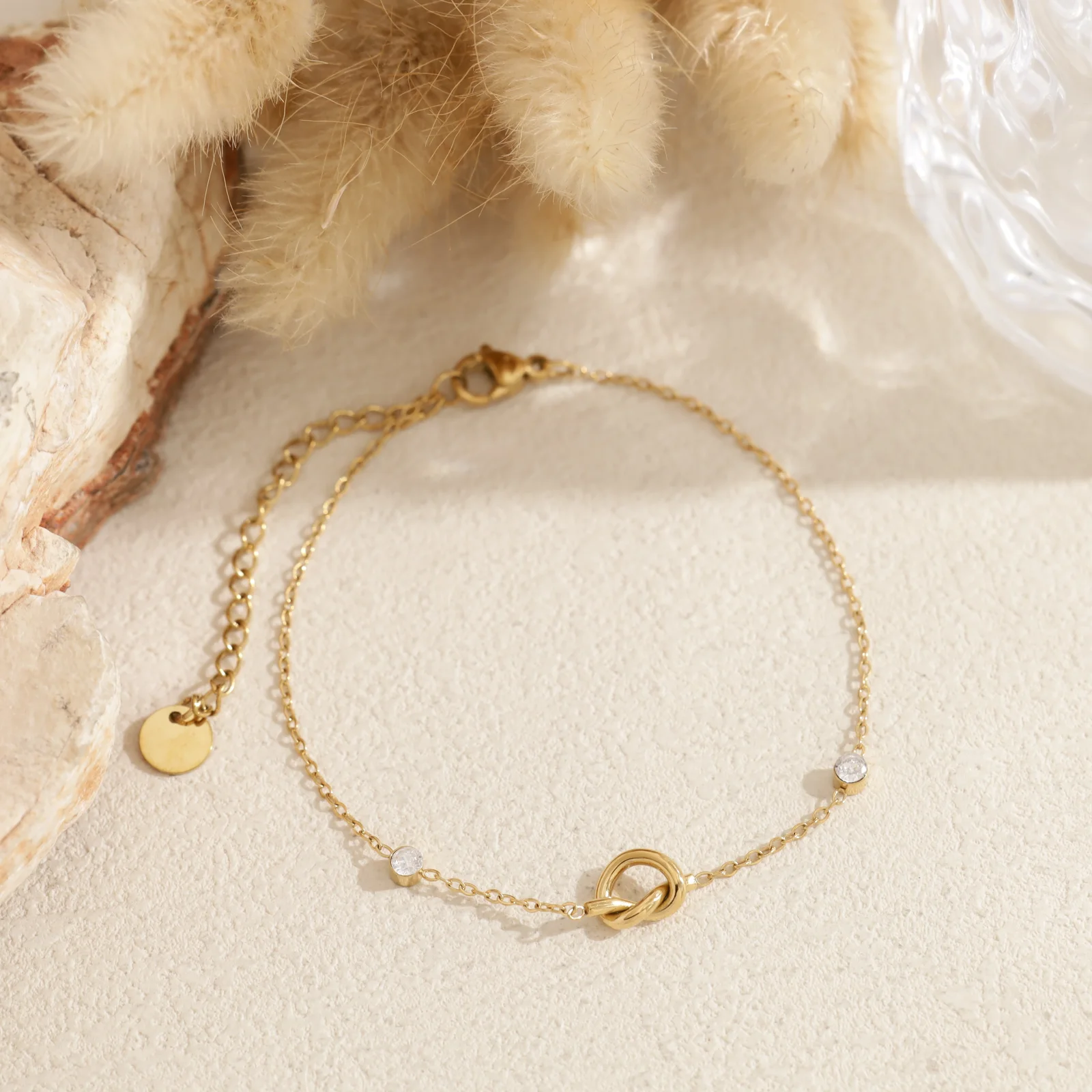 Bracelet chaîne fine nœud serti